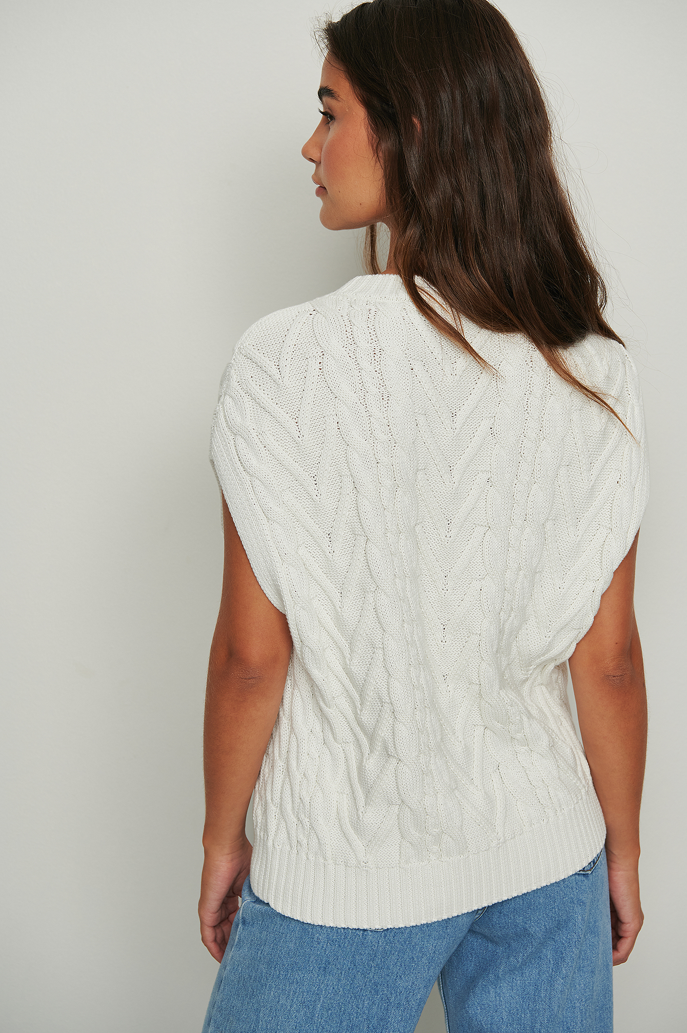white knitted vest