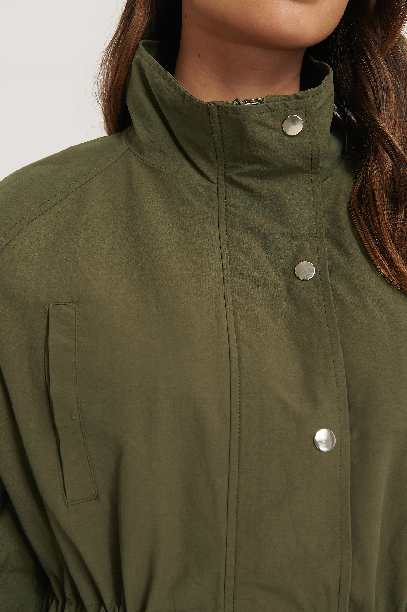 green drawstring jacket