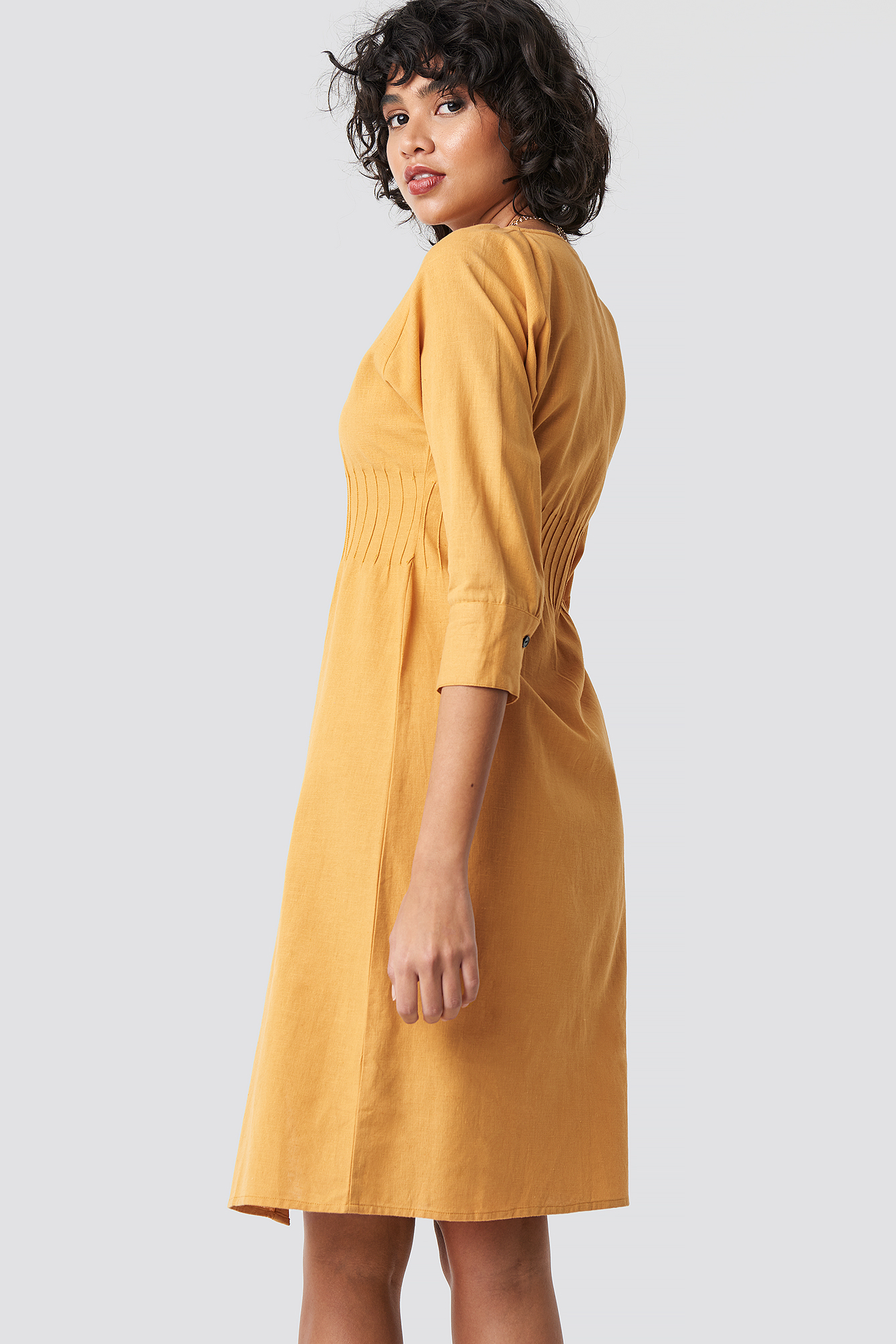 yellow buttoned dress